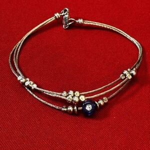 Silver Tone Wire Bracelet With Blue Bead & Gems